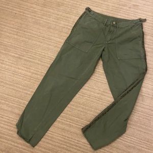 Army green cotton pants with snakeskin trim on sides.